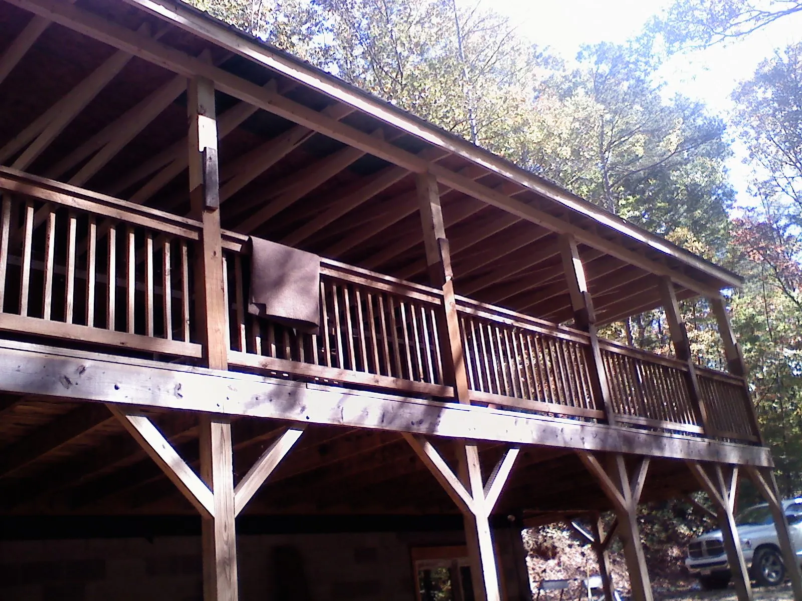 Timber framing under a new elevated porch and deck — Roof Leak Repair in Iowa City by Roofing Brothers